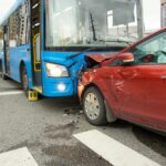 A head-on collision involving a bus and car