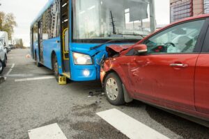 A head-on collision involving a bus and car